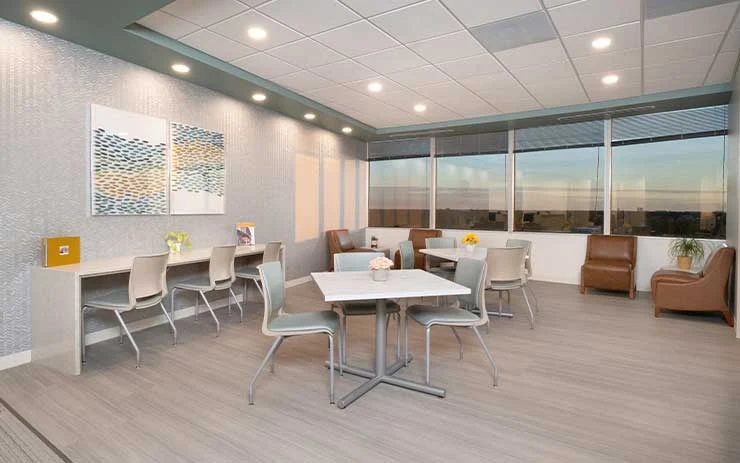 Group therapy room with tables and seating area