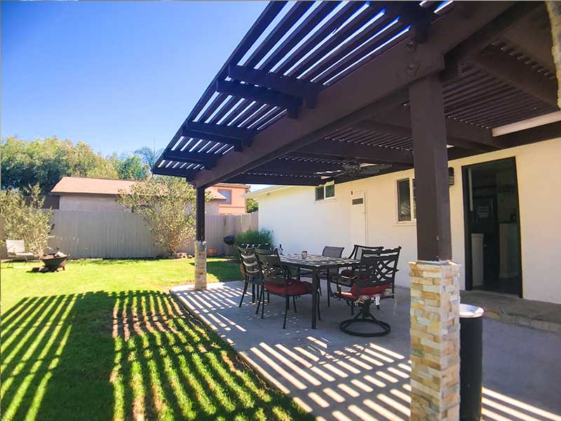 Outdoor patio with dining set under pergola