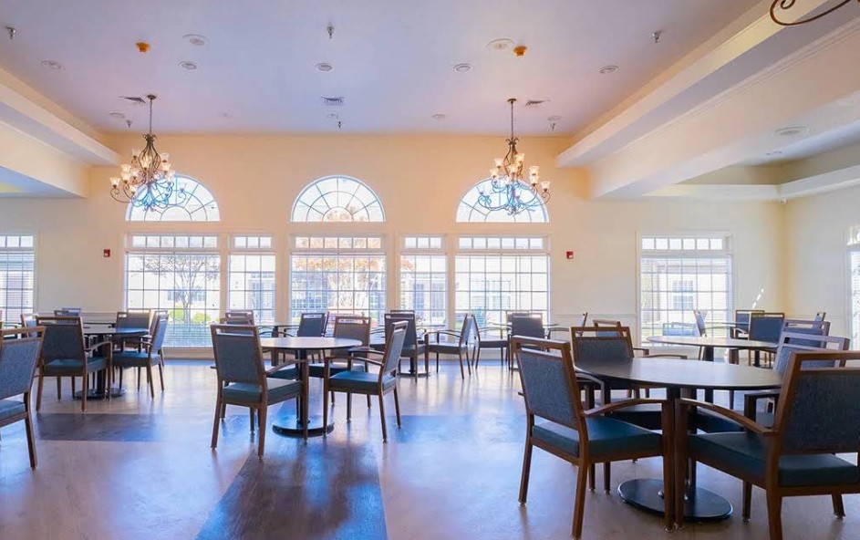 Spacious dining room with ample seating and large windows for shared meals at Promises Dallas–Fort Worth