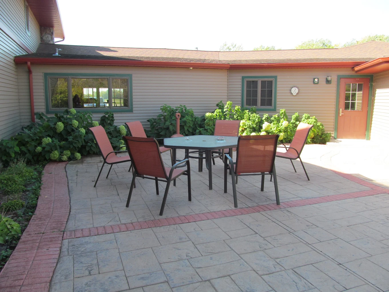 Outdoor patio with seating for relaxation and group time