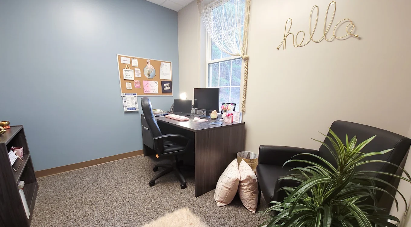 BrightView Fredericksburg counseling room with desk, chairs, computer workstation, and plant