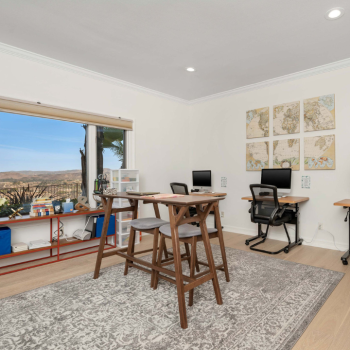 Study room with desks, computers, and mountain view