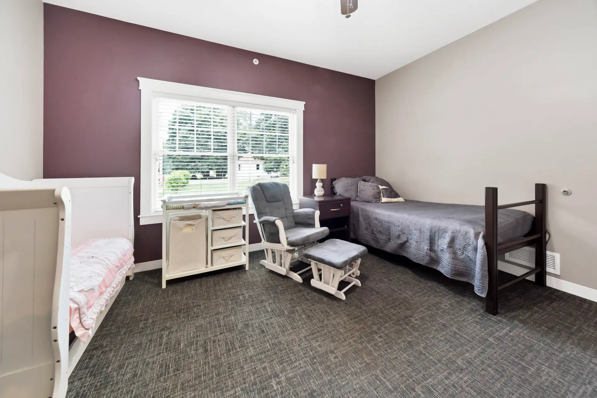 Shared bedroom with beds and seating at Oak House