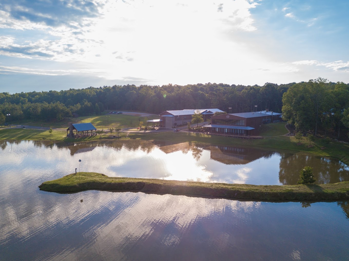 Aerial view of a rehab facility with a lake