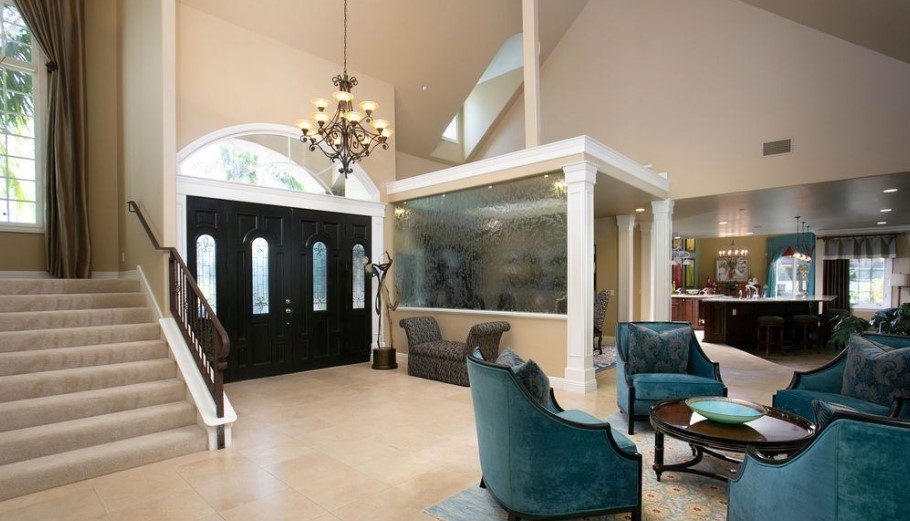 Living area with seating and stairs.