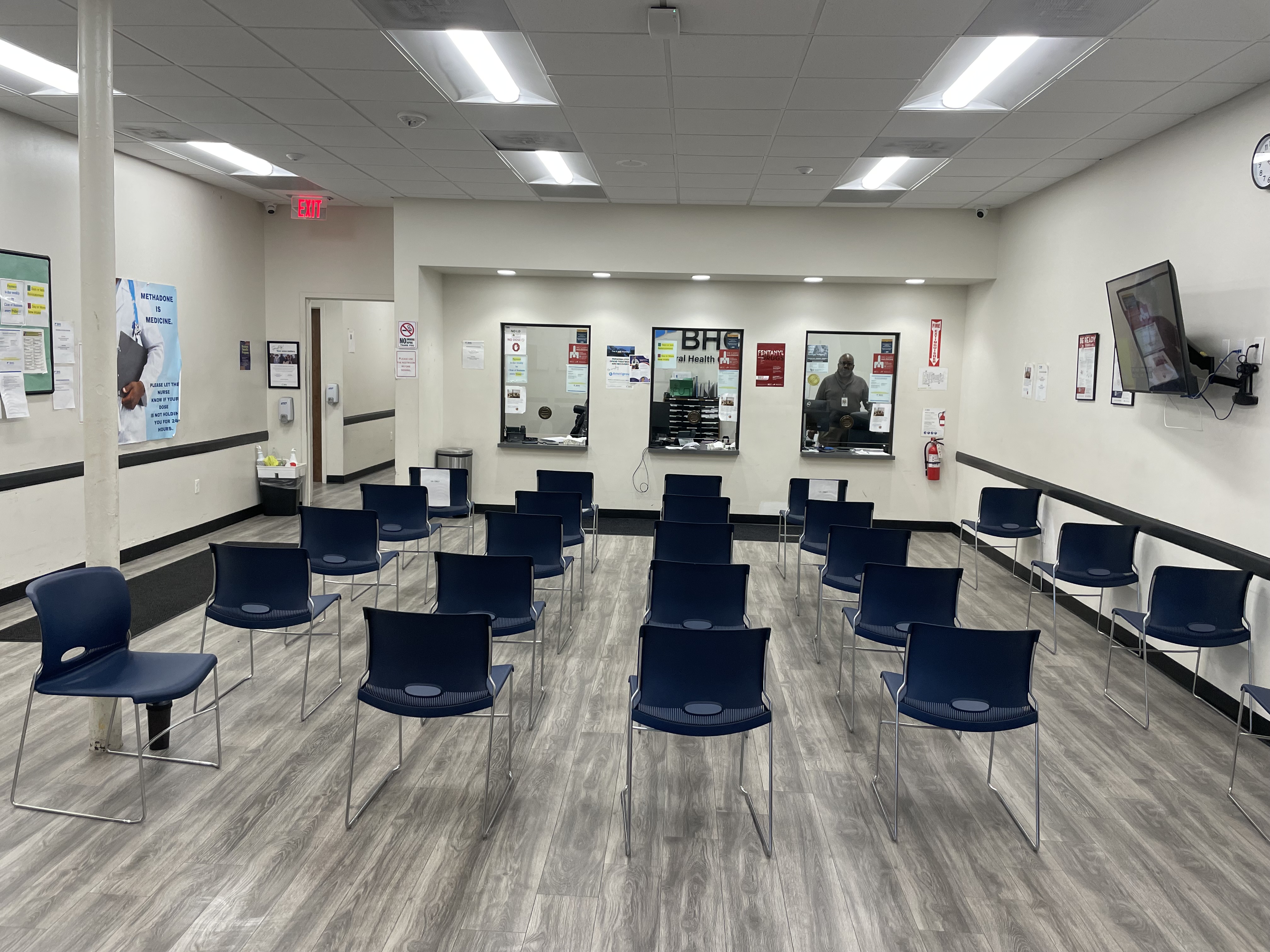 Front view of waiting room facing patient service windows