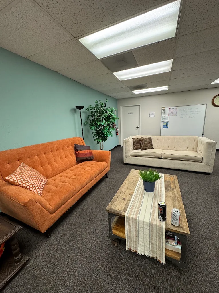 Client lounge with sofas, coffee table, and seating