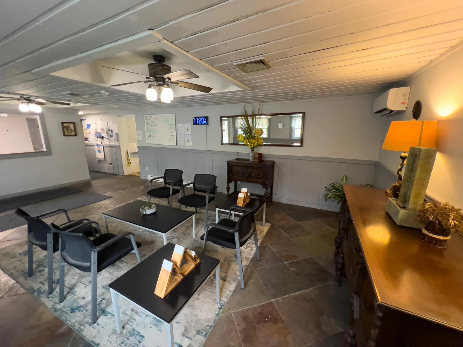 Reception area with black chairs and modern decor