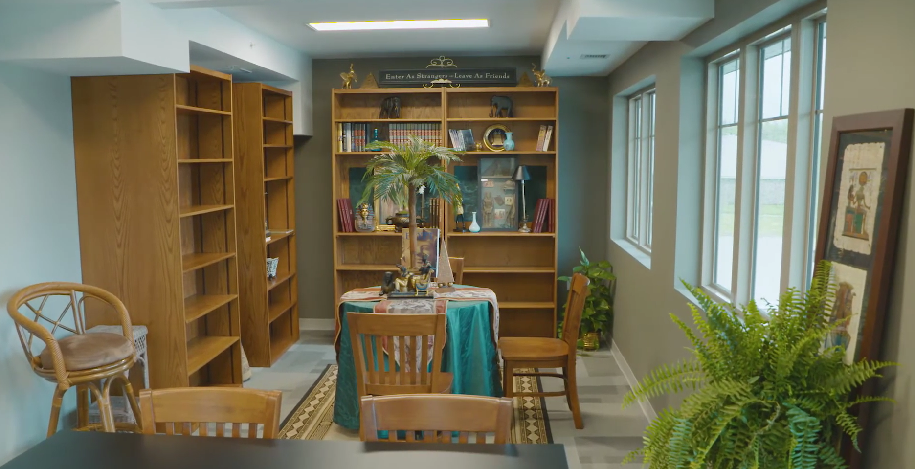 Cozy library space with table and bookshelves