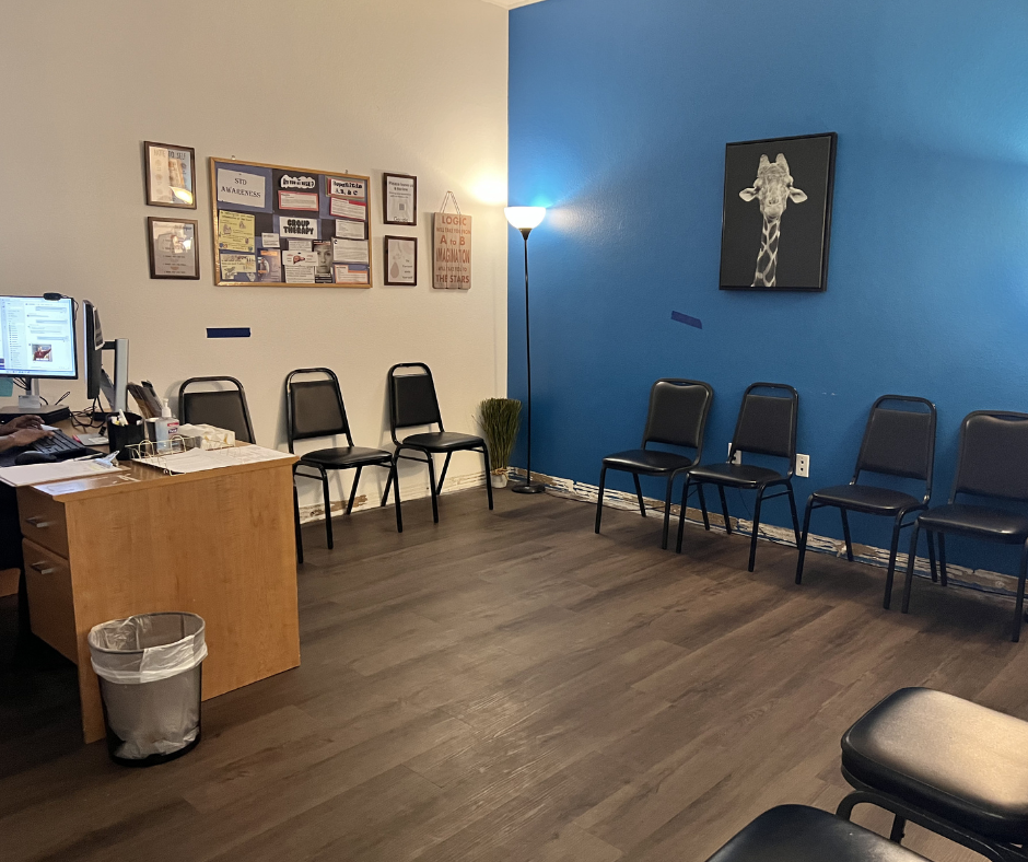 Waiting area with chairs and informational bulletin board