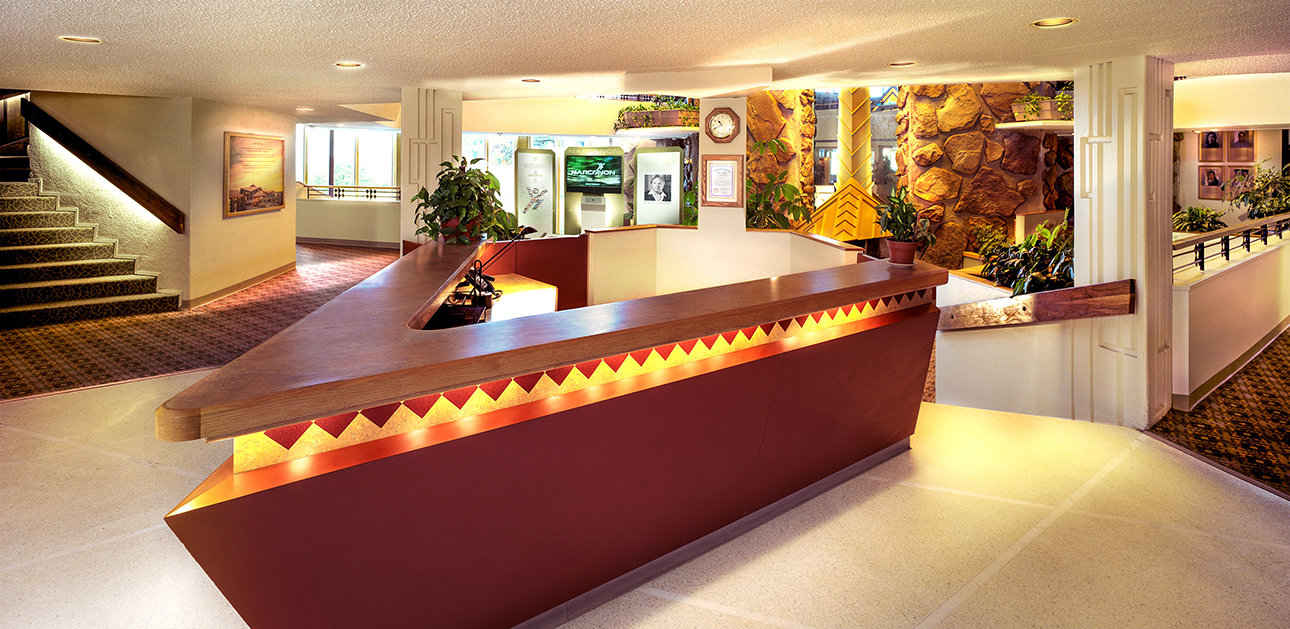 Reception desk in a spacious interior lobby