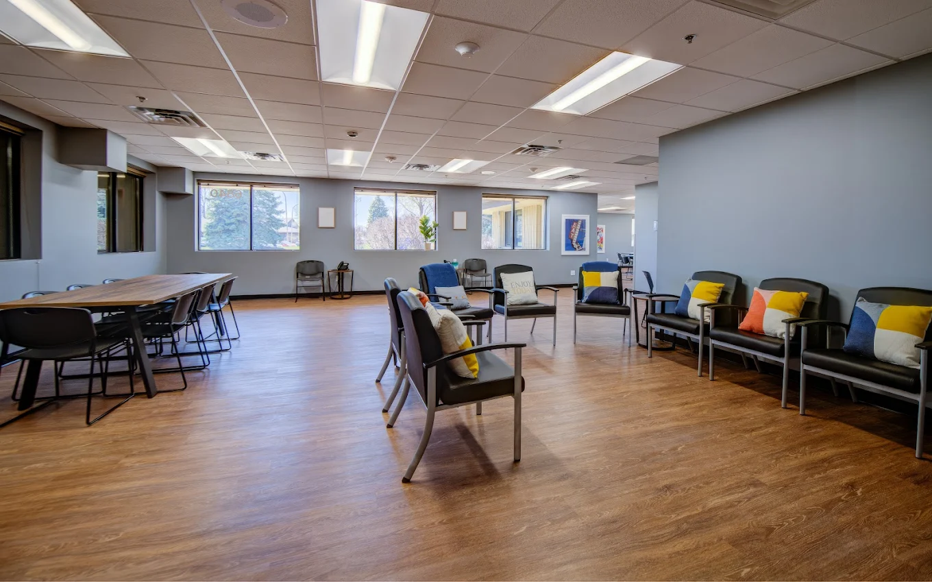 Large meeting lounge with chairs, pillows, and tables