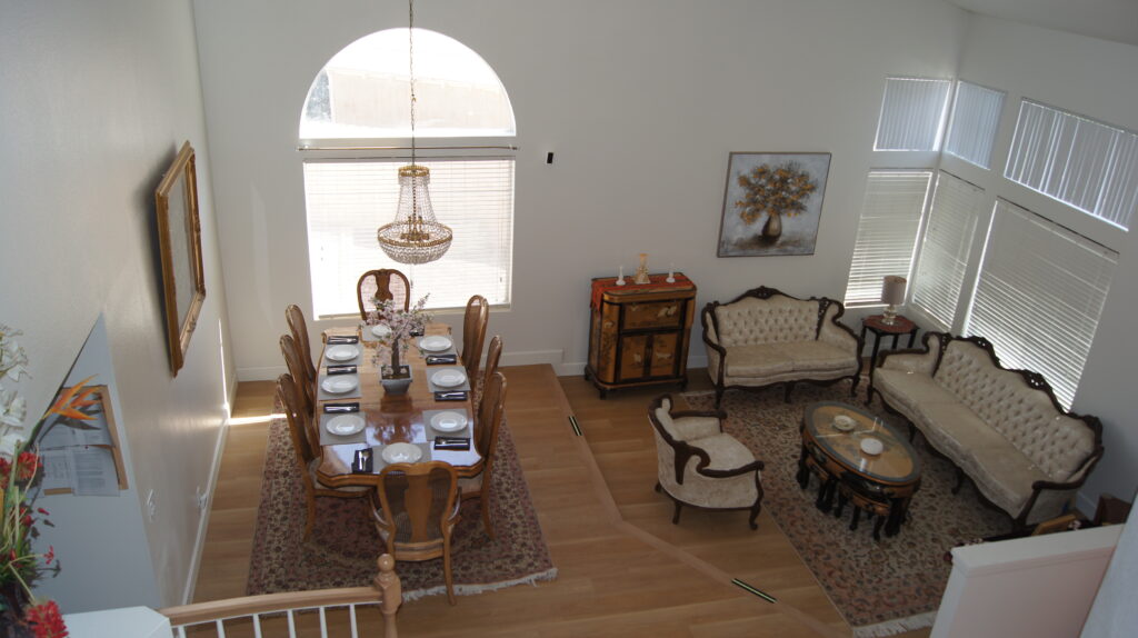 Formal dining table set for ten under chandelier