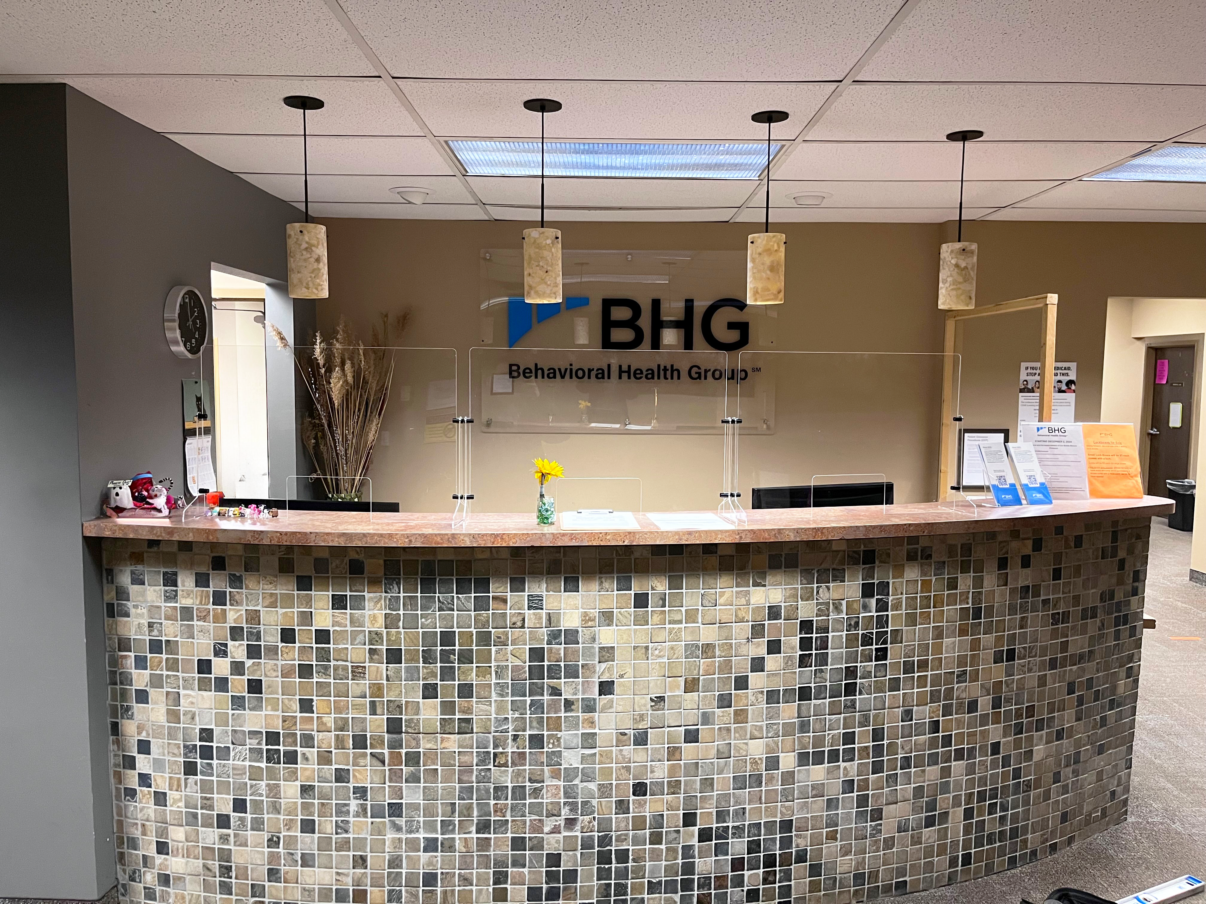 Reception desk with check-in counter and BHG lobby sign