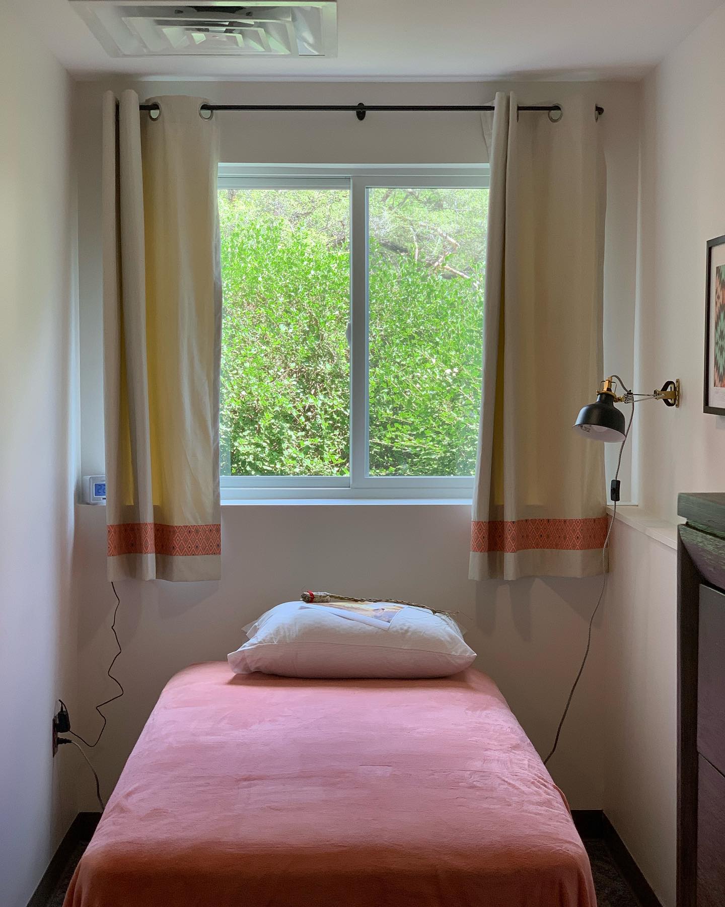 Small private bedroom with single bed and large window