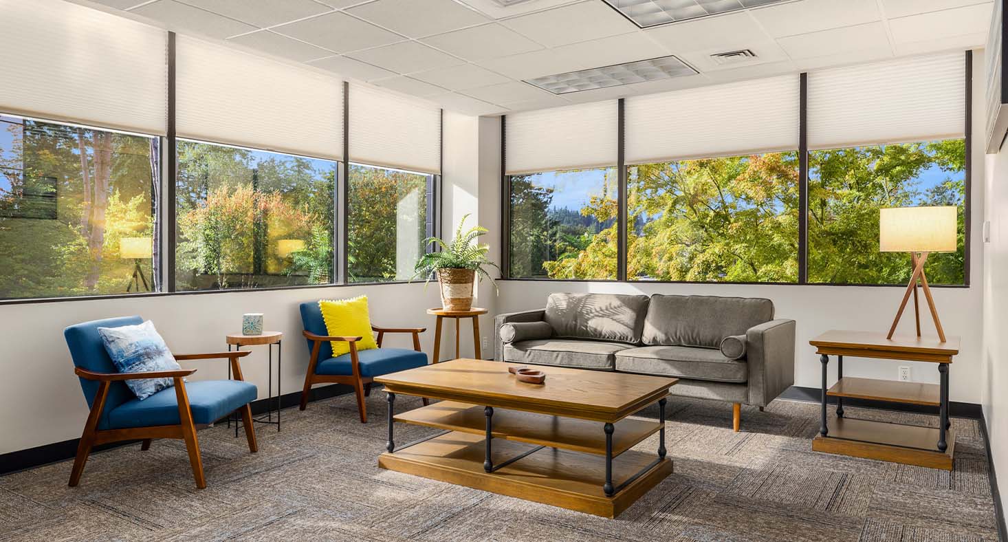 Lounge with large a sofa and chairs.