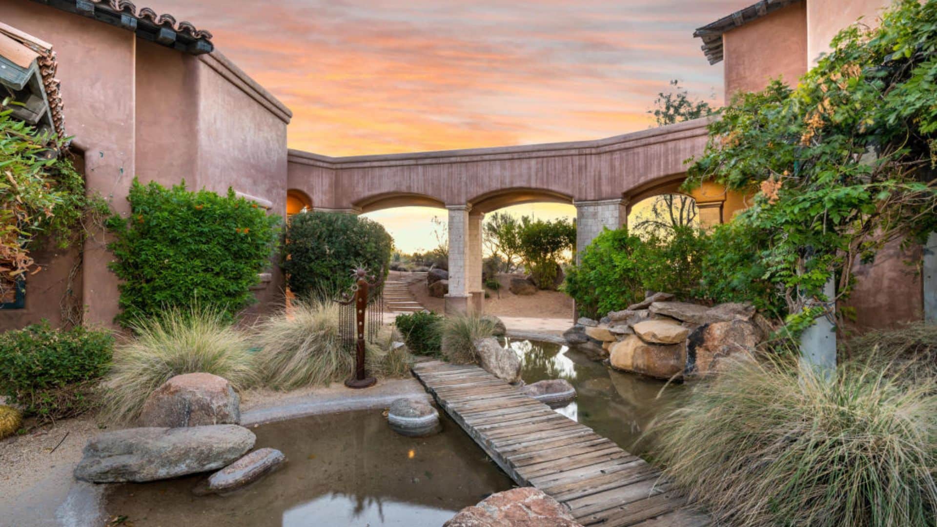 Small pond with a wooden bridge.