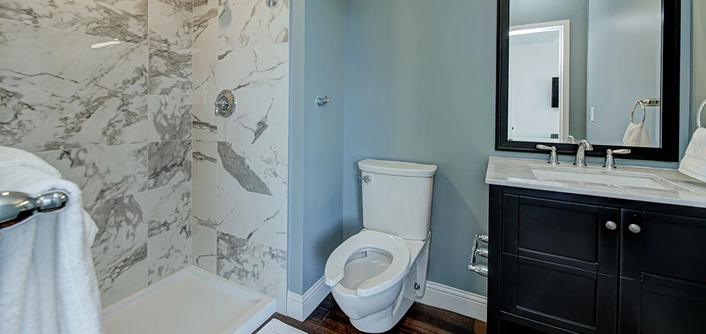 Bathroom with marble shower and modern vanity